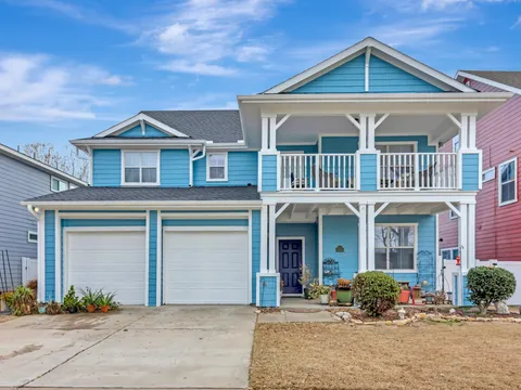 Two-story Fort Worth home with a painted porch and balcony