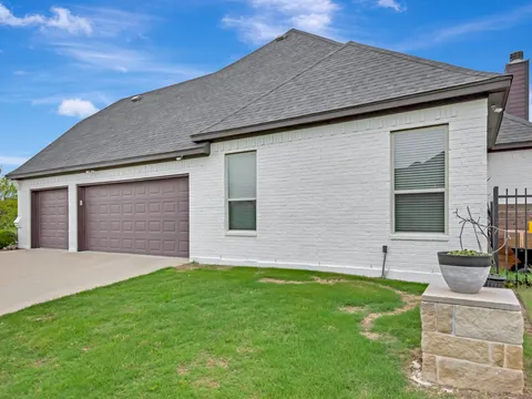 Large Westlake elevation in painted brick and stone