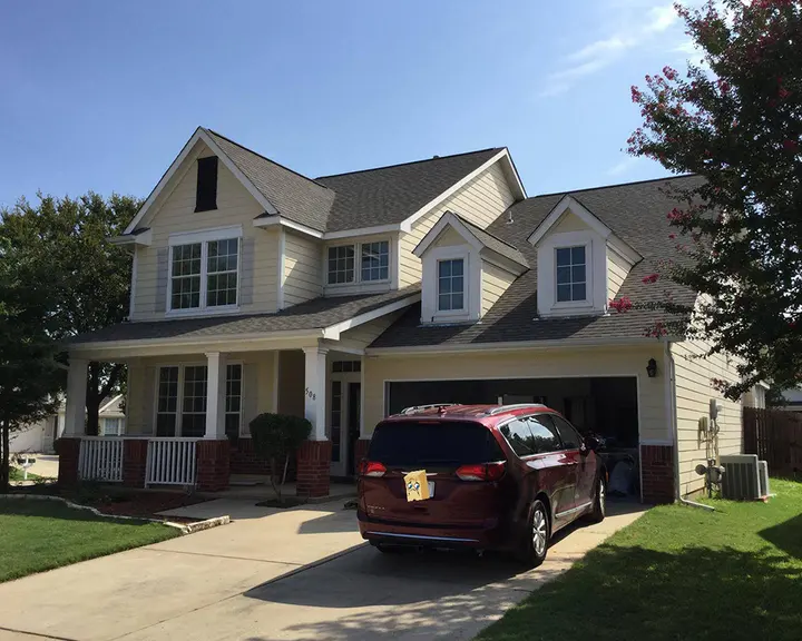 Siding and trim recoated in a deeper scheme — before