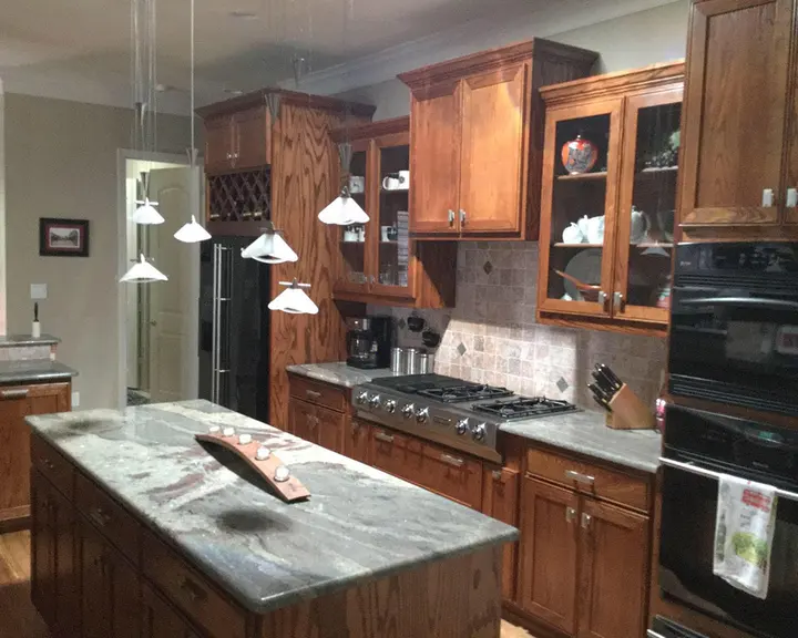 Cherry cabinets and island repainted, worktops kept — before