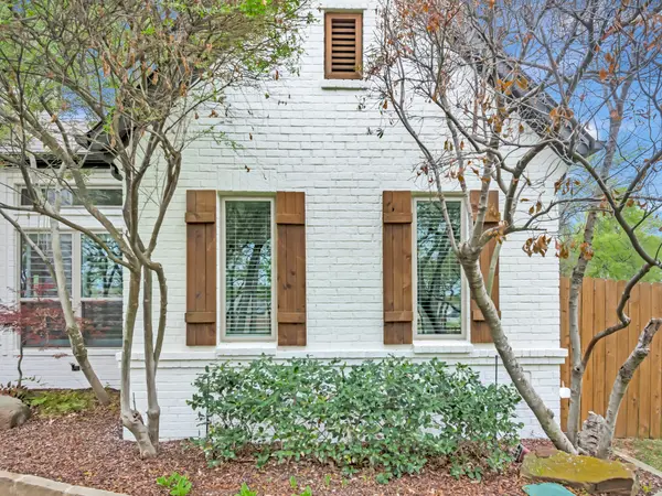 Painted brick elevation with timber shutters
