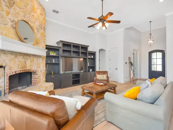 Repainted living room with built-in shelving