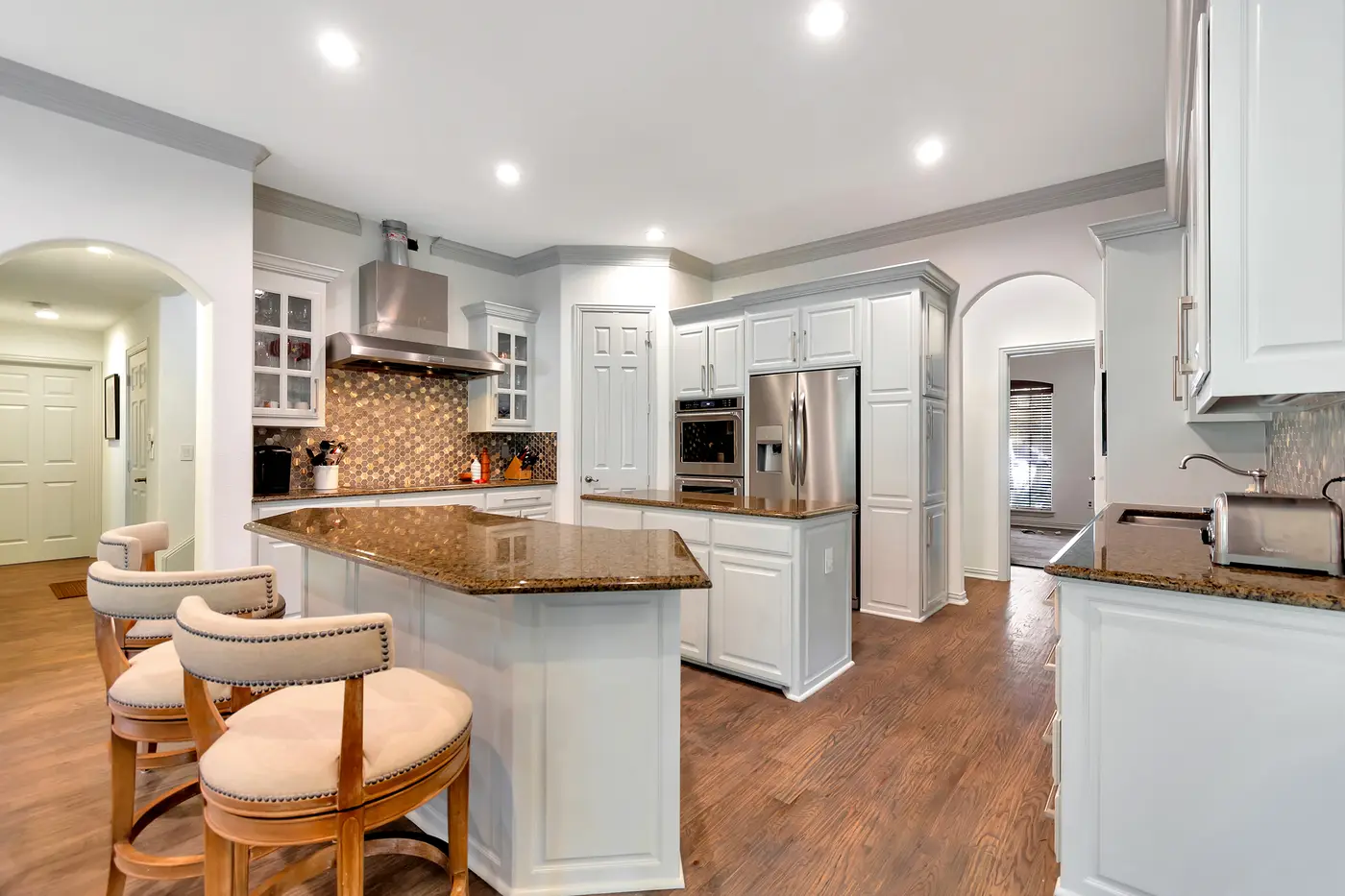 Painted kitchen cabinetry with granite worktops
