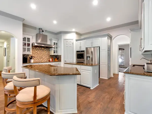 Painted kitchen cabinetry with granite worktops