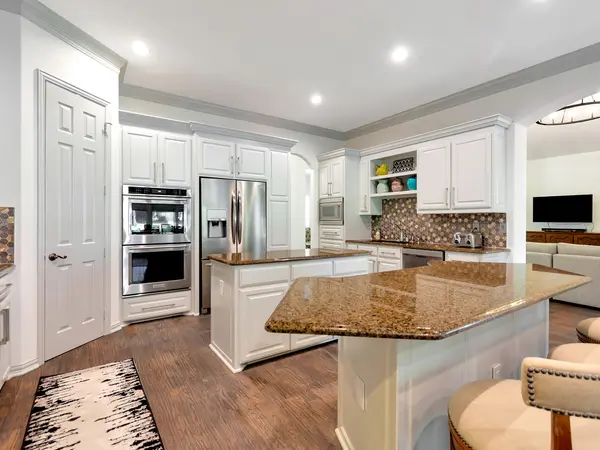 Painted cabinetry in an open-plan kitchen