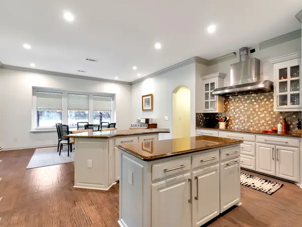 Painted kitchen cabinetry with granite worktops