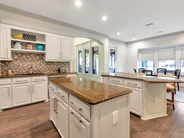 Painted kitchen cabinetry with granite worktops