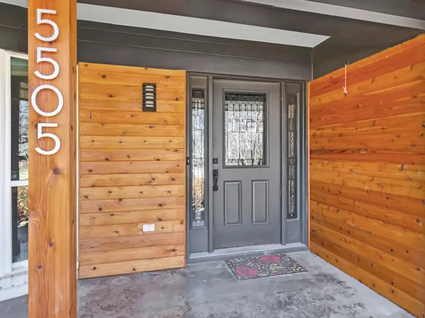 Painted brick entry with a contrasting front door