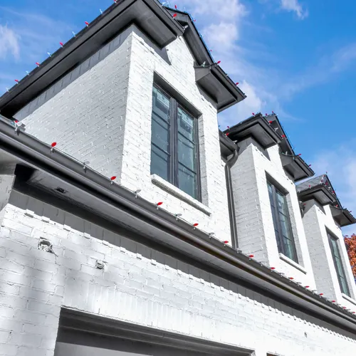 Painted brick gable and trim detail on a Metroplex home