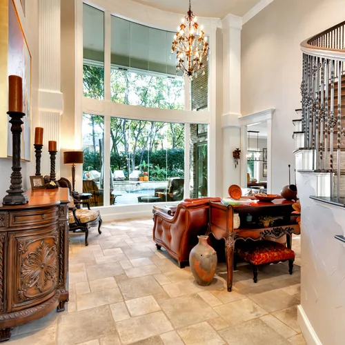 Two-story entry hall with painted walls, trim and iron balustrade