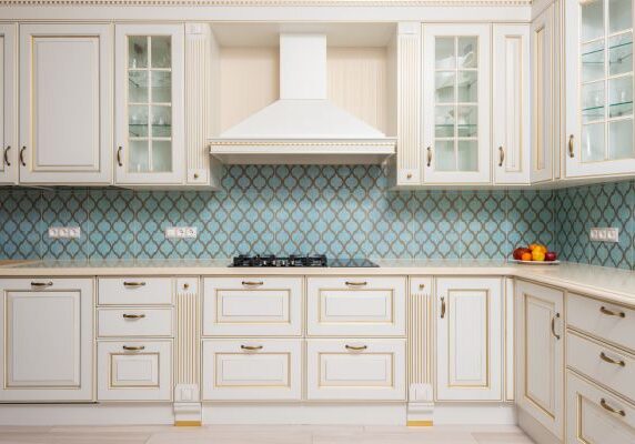 Custom Kitchen with White and Gold Painted Cabinets
